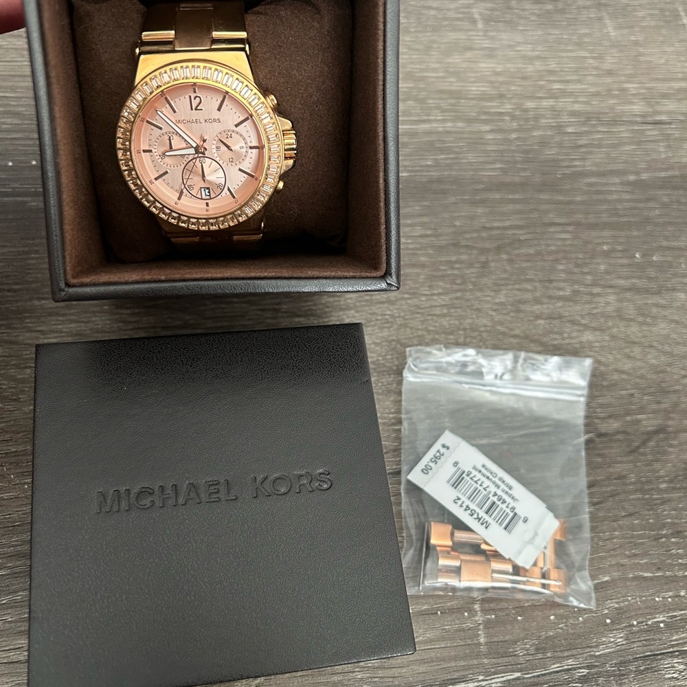 Michael Kors rose gold link watch. Comes with box, extra links and original tag